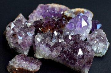 Beautiful natural colored semi-precious stones. Close-up of amethyst druse on dark background....