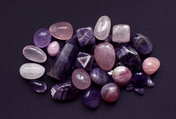 Beautiful natural semi-precious stones of chevron amethyst and rose quartz. Predictions, witchcraft, spiritual esoteric practice.