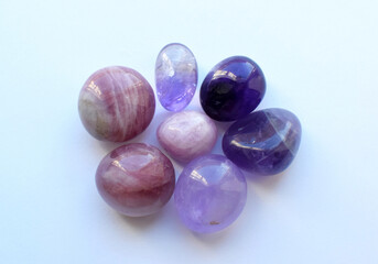 Beautiful natural semi-precious stones of amethyst and rose quartz. Predictions, witchcraft, spiritual esoteric practice.