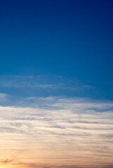 Tranquil Horizon Framed by Soft Feathered Clouds 