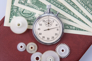 mechanical stopwatch on the background of dollars. Part time accuracy for business. business and...