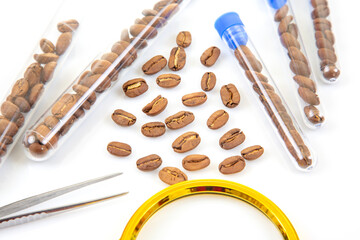 Close-up of coffee beans being analyzed in a laboratory setting with scientific tools and test tubes