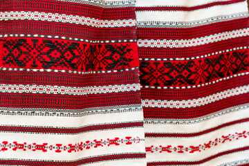 Colorful traditional folk fabric featuring intricate patterns and vibrant colors from a cultural celebration