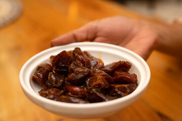 Close up of a bowl of dates served at the Al Koot Heritage Hotel
