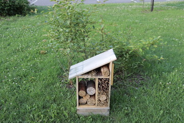 Wooden house for bees. Log and piece of wood for bee shelter. Bees and ecology and environment....