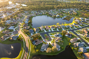 Large residential homes in southwest Florida gated community. American houses in rural US suburbs