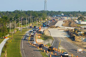 Roadworks construction site on American highway. Development of city transportation crossroads
