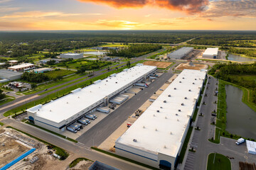 Warehouse construction. Concrete and metal structure of industrial building. Frame of modern...