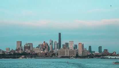Stunning view of modern skyscrapers in Midtown Manhattan, New York City, under a clear blue sky.