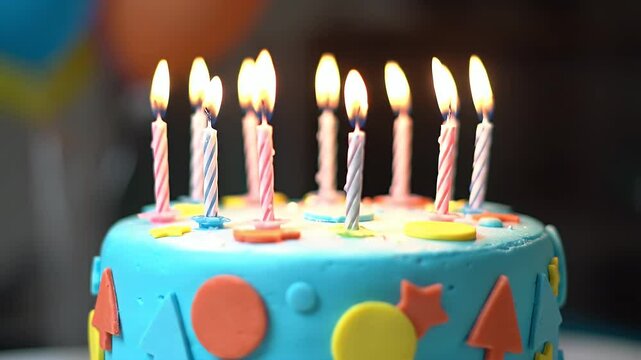 Decorated Birthday Cake with Geometric Shapes and Lit Candles For Celebration Events Medium Shot