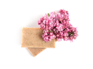 Soap bars and lilac flowers isolated white