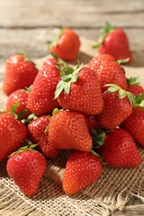 Fresh ripe strawberries on wooden table, closeup