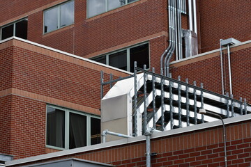 Large cable trays running across hospital rooftop. Electrical, HVAC, fiber, phone, communication and internet lines.