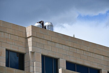 Some sort of mechanical device on top of large government building.