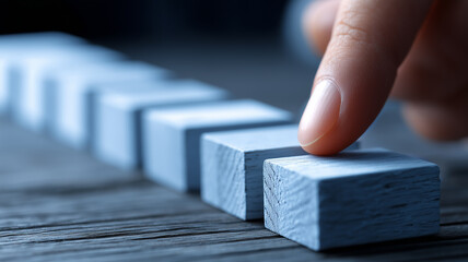 Meticulous project control illustrated by executive finger selecting precise block within organized planning sequence.
