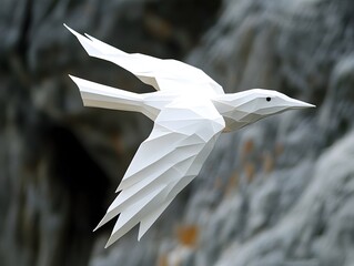 White polygonal bird soars against a blurred rocky cliff, epitomizing freedom and minimalist design.