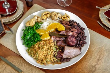 The best traditional Brazilian feijoada completely served in the most authentic style accompanied by the irresistible and iconic cachaça caipirinha