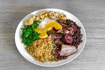The best traditional Brazilian feijoada completely served in the most authentic style accompanied by the irresistible and iconic cachaça caipirinha