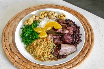 The best traditional Brazilian feijoada completely served in the most authentic style accompanied by the irresistible and iconic cachaça caipirinha