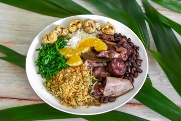 The best traditional Brazilian feijoada completely served in the most authentic style accompanied by the irresistible and iconic cachaça caipirinha