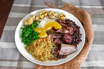 The best traditional Brazilian feijoada completely served in the most authentic style accompanied...