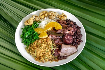 The best traditional Brazilian feijoada completely served in the most authentic style accompanied by the irresistible and iconic cachaça caipirinha