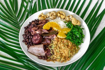 The best traditional Brazilian feijoada completely served in the most authentic style accompanied by the irresistible and iconic cachaça caipirinha