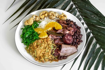 The best traditional Brazilian feijoada completely served in the most authentic style accompanied by the irresistible and iconic cachaça caipirinha