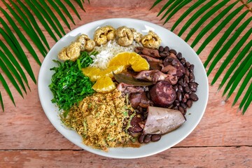 The best traditional Brazilian feijoada completely served in the most authentic style accompanied by the irresistible and iconic cachaça caipirinha