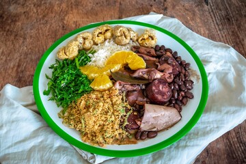 The best traditional Brazilian feijoada completely served in the most authentic style accompanied by the irresistible and iconic cachaça caipirinha