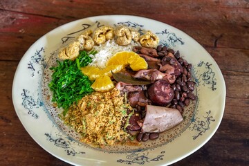 The best traditional Brazilian feijoada completely served in the most authentic style accompanied by the irresistible and iconic cachaça caipirinha