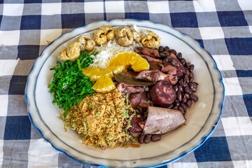 The best traditional Brazilian feijoada completely served in the most authentic style accompanied by the irresistible and iconic cachaça caipirinha