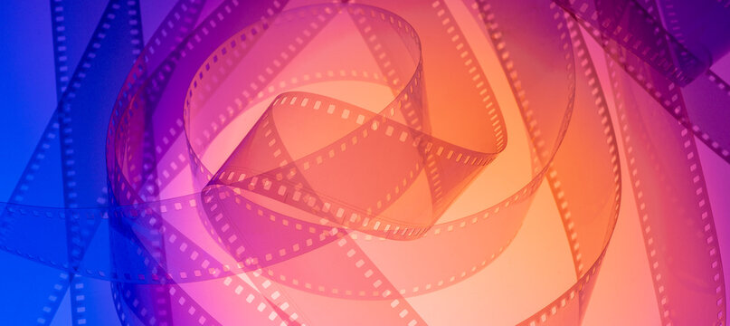abstract background with film strip.developed transparent film strip with free space for advertising for colorful multicolored cinematic background poster banner flyer invitation
