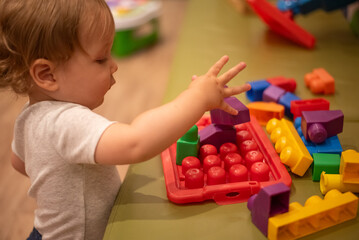 Baby playing with building blocks