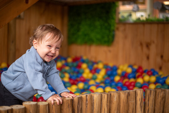 Baby having fun in the ball pit