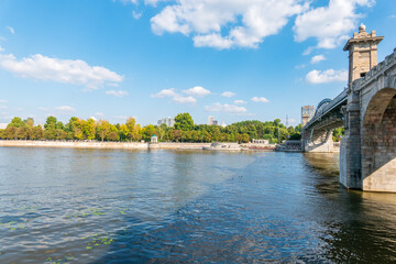 View of the Moscow river embankment, Pushkinsky bridge and cruise ships at sunset.