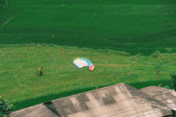 ChatGPT의 말:
Colorful paragliding over lush green hills and rice fields in Vietnam Sapa for...