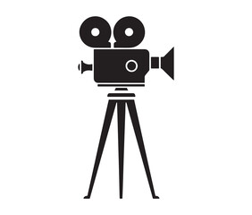 Silhouette of an old movie camera on a tripod. Vintage movie camera on tripod silhouette.