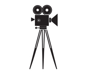 Silhouette of an old movie camera on a tripod. Vintage movie camera on tripod silhouette.