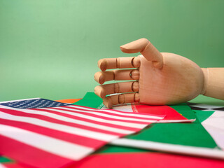Hand shake with world wide flag country on a greem background. Geopolitical concept