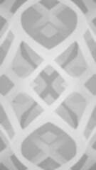 Soft focus grey abstract geometric pattern with intersecting lines and diamond shapes