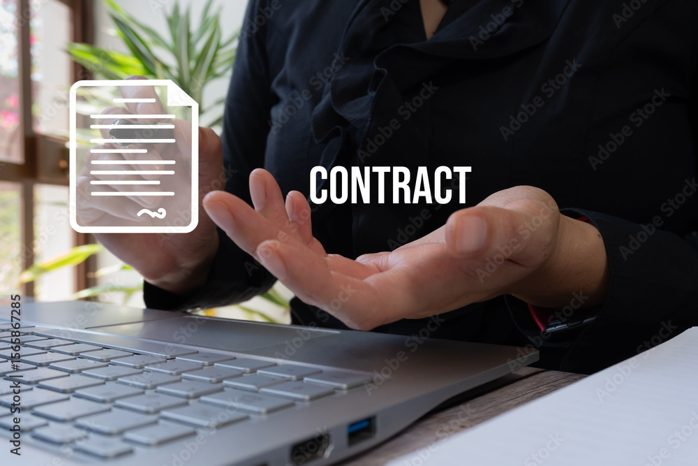 Poster businesswoman's hand in front of a computer holding the word 