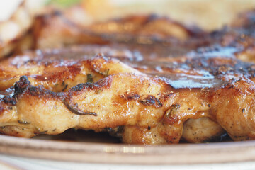 Grilled chicken close-up at a summer barbecue gathering