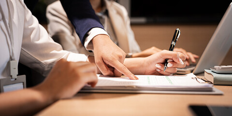 close up hands Company executive coaching young personal secretary assistant, team leader or senior...