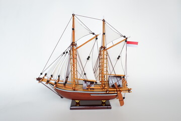 wooden sailing ship model in white background