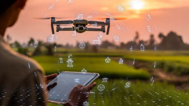 Farmer using tablet to control drone in precision farming