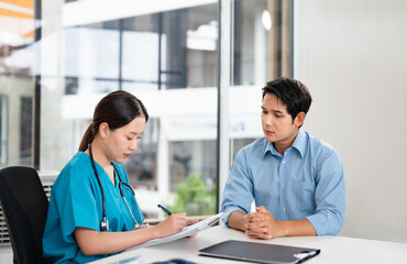 Female doctor giving a consultation to a patient and explaining medical informatics and diagnosis.Consulting, medical and results for patient by doctor for planning, treatment and life insurance.