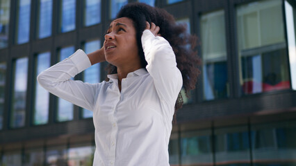African American woman worker employer female emotional girl businesswoman outdoors mad displeased...