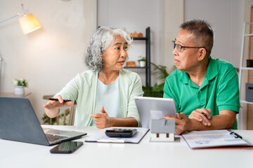 Retirement, senior couple and ecommerce on laptop for home purchase finance decision together. Happy married people with financial choice for online shopping payment with wireless technology.