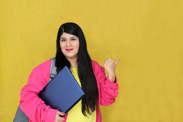 A successful and empowered 30-year-old Latina brings her laptop to study and work remotely